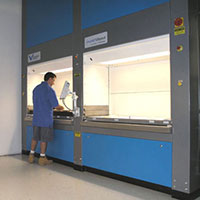 Employee using a vertical lift module system